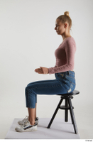  Kate Jones  1 blue jeans casual dressed pink long sleeve t shirt sitting white sneakers whole body 0009.jpg